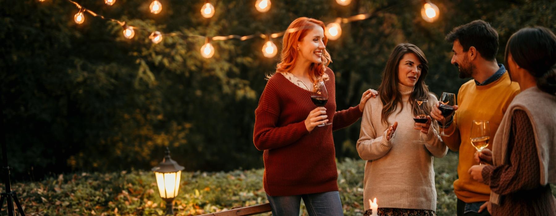 a group of people drinking wine