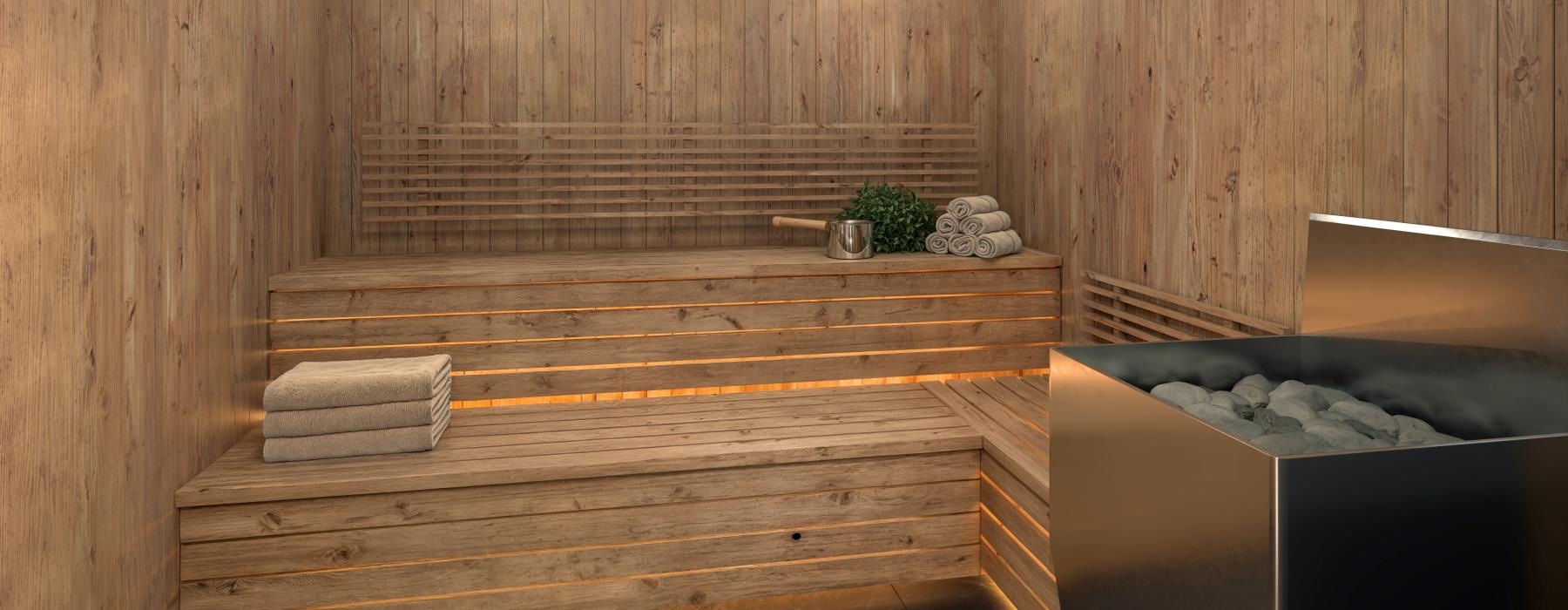 a sauna with towels on a bench