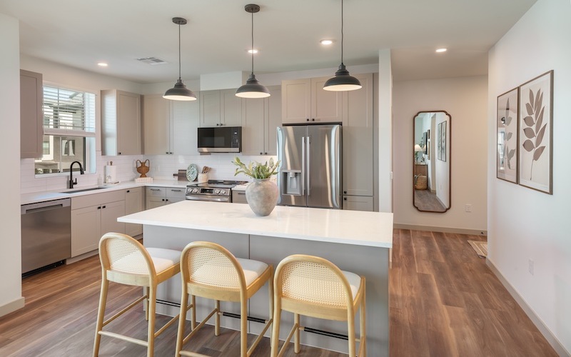 a kitchen with a table and chairs