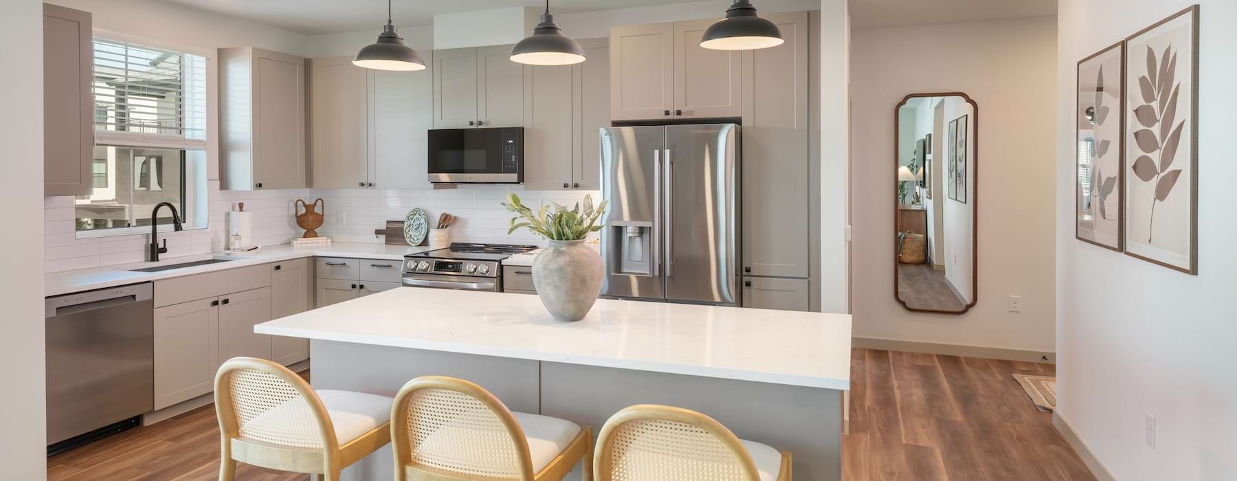 a kitchen with yellow chairs