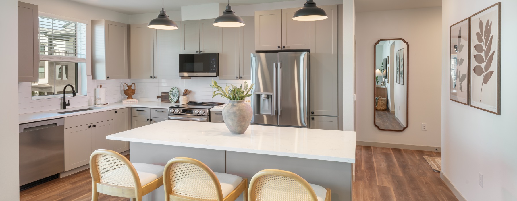 a kitchen with a table and chairs